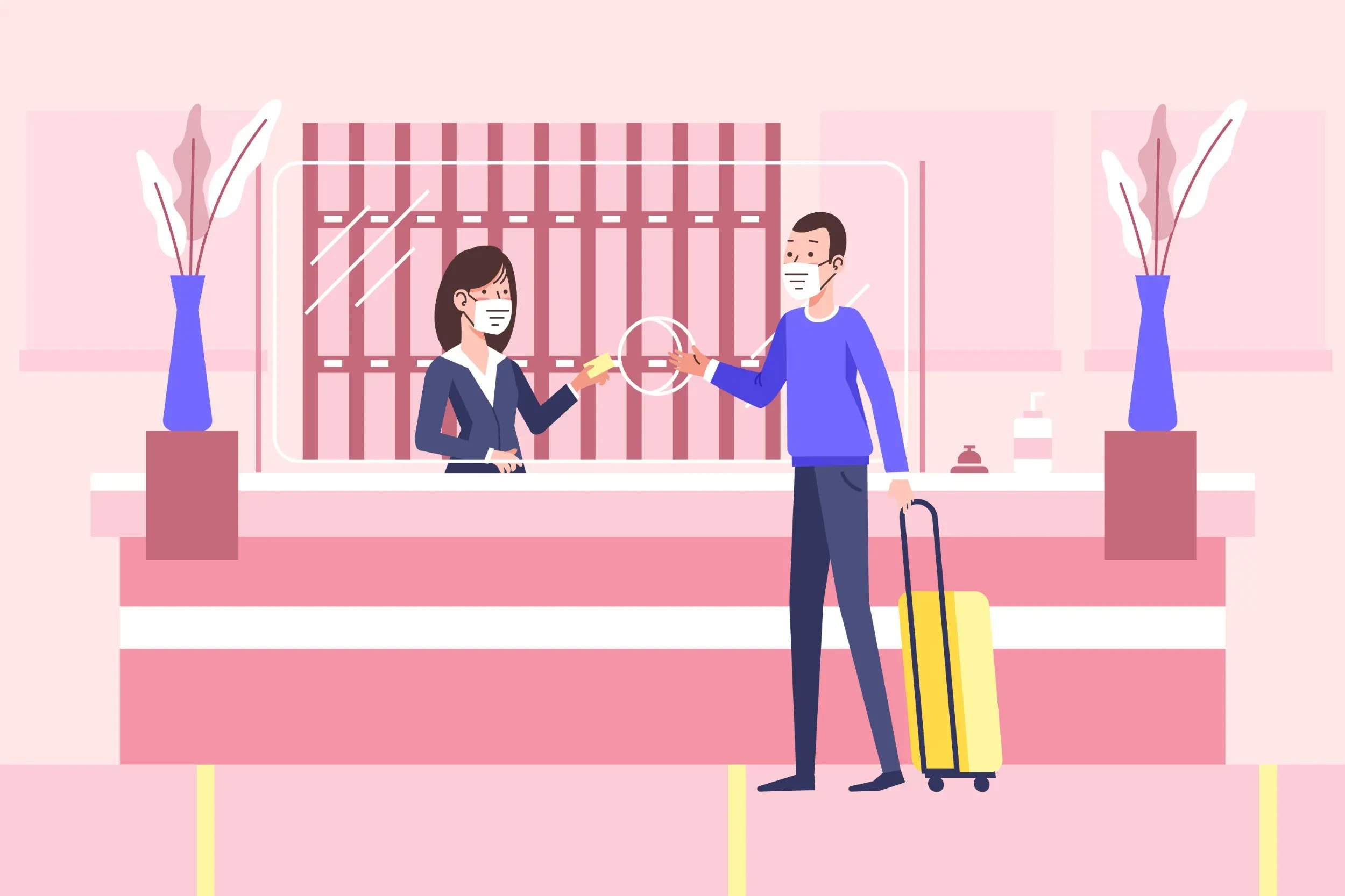 Hotel guest checking in at the reception desk while a hotel staff member assists with the check-in process
