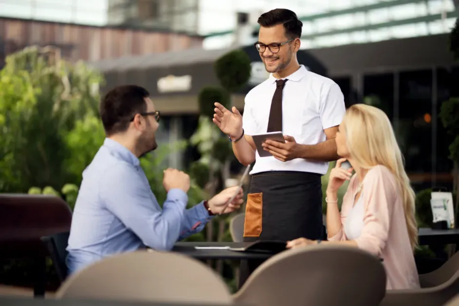 Hotel guest using mobile phone to request room service through guest experience software