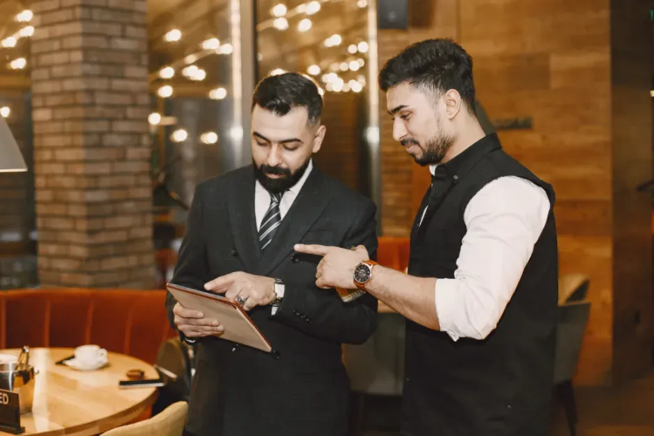 Hotel manager analyzing business performance and operational data to improve hotel results